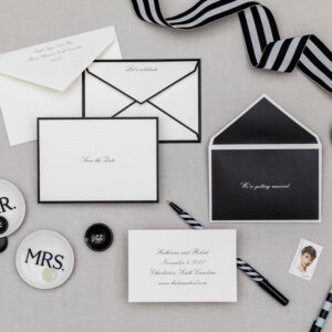 series of four black and white nesting envelopes with save the date card